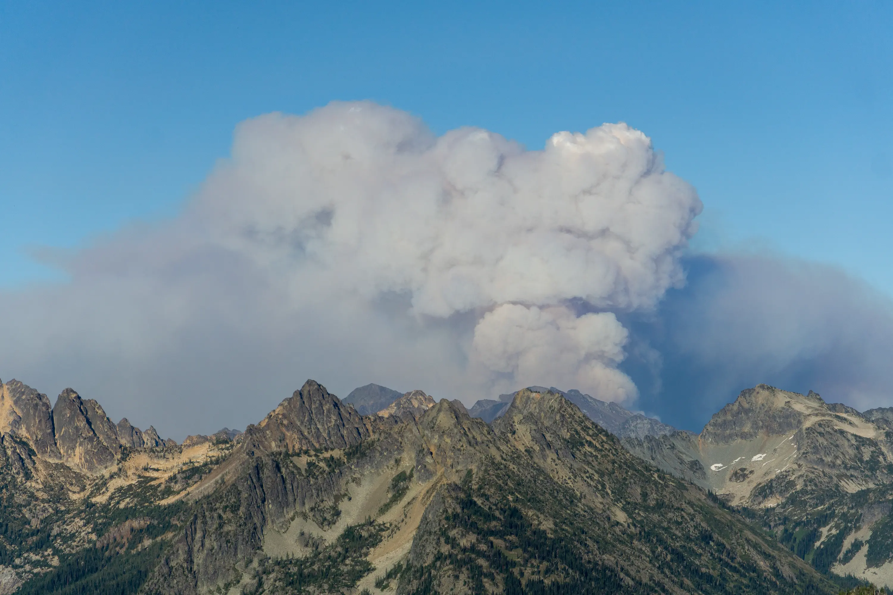 A pyrocumulus day in the north cascades. The Gardner Creek fire rages only a few miles away, while the wind keeps our area of the mountains perfectly clear.