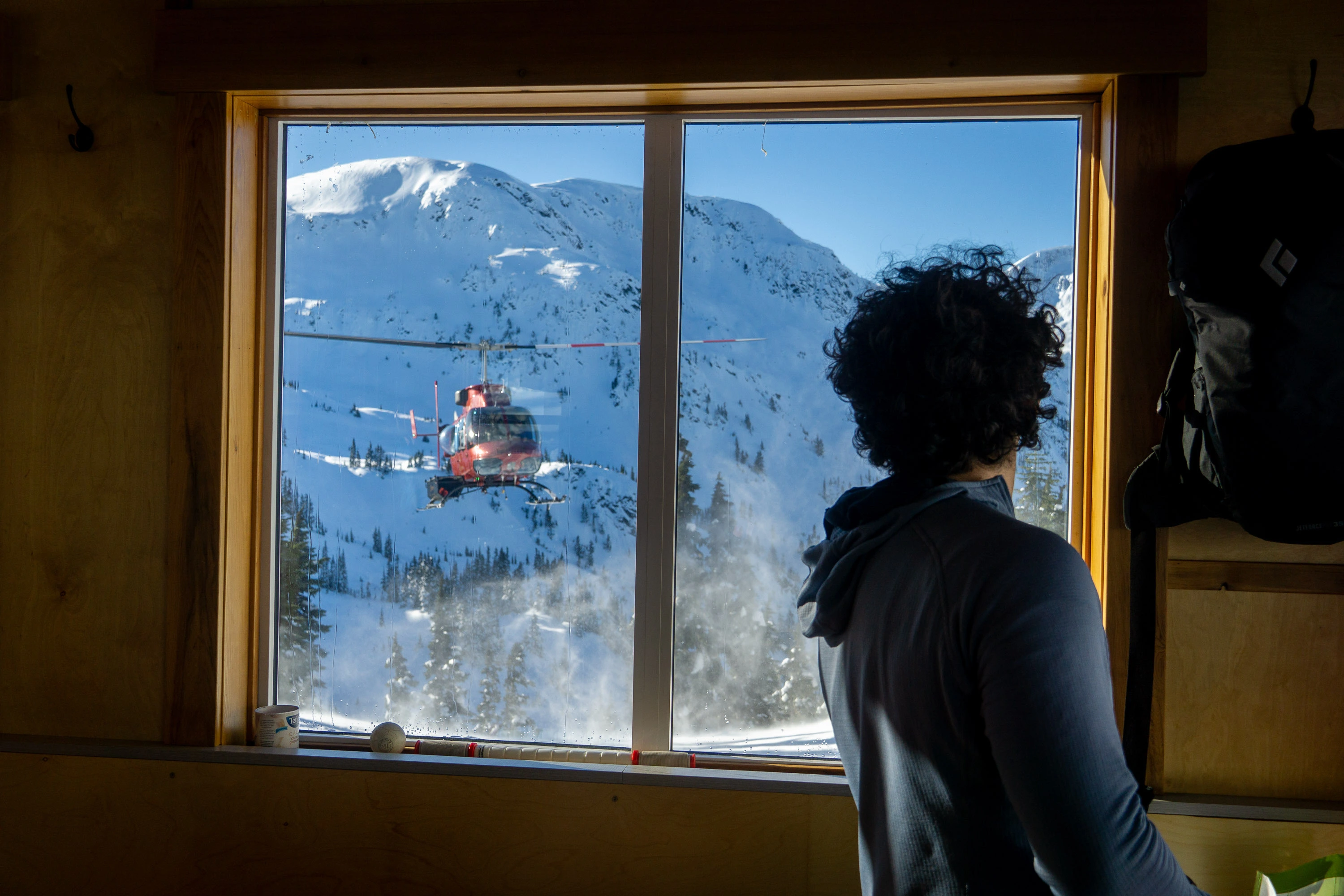 Helicopter approaching ski hut, B.C.