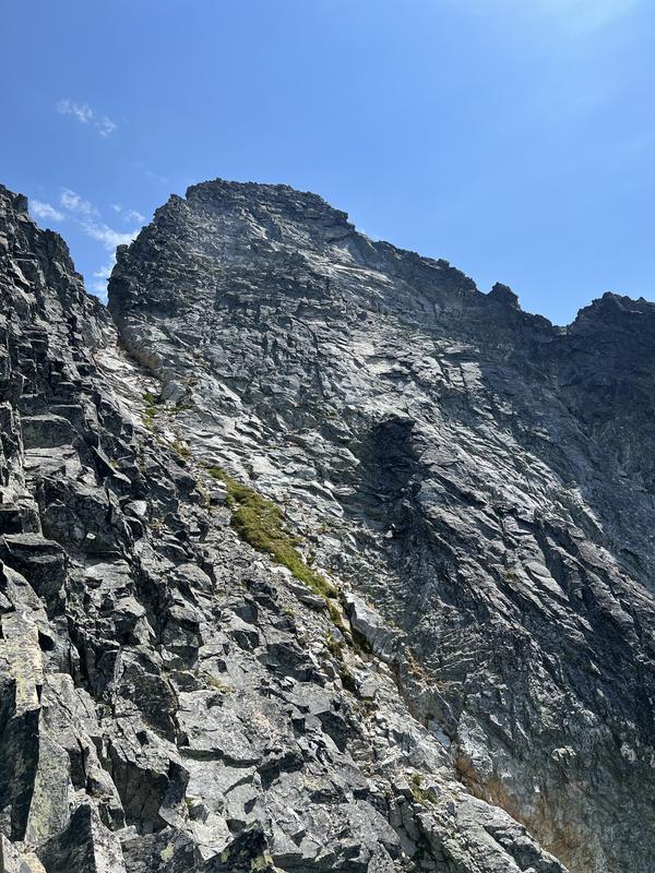 False summit on the left, true summit on the right, notice the band of white rock on the true summit block